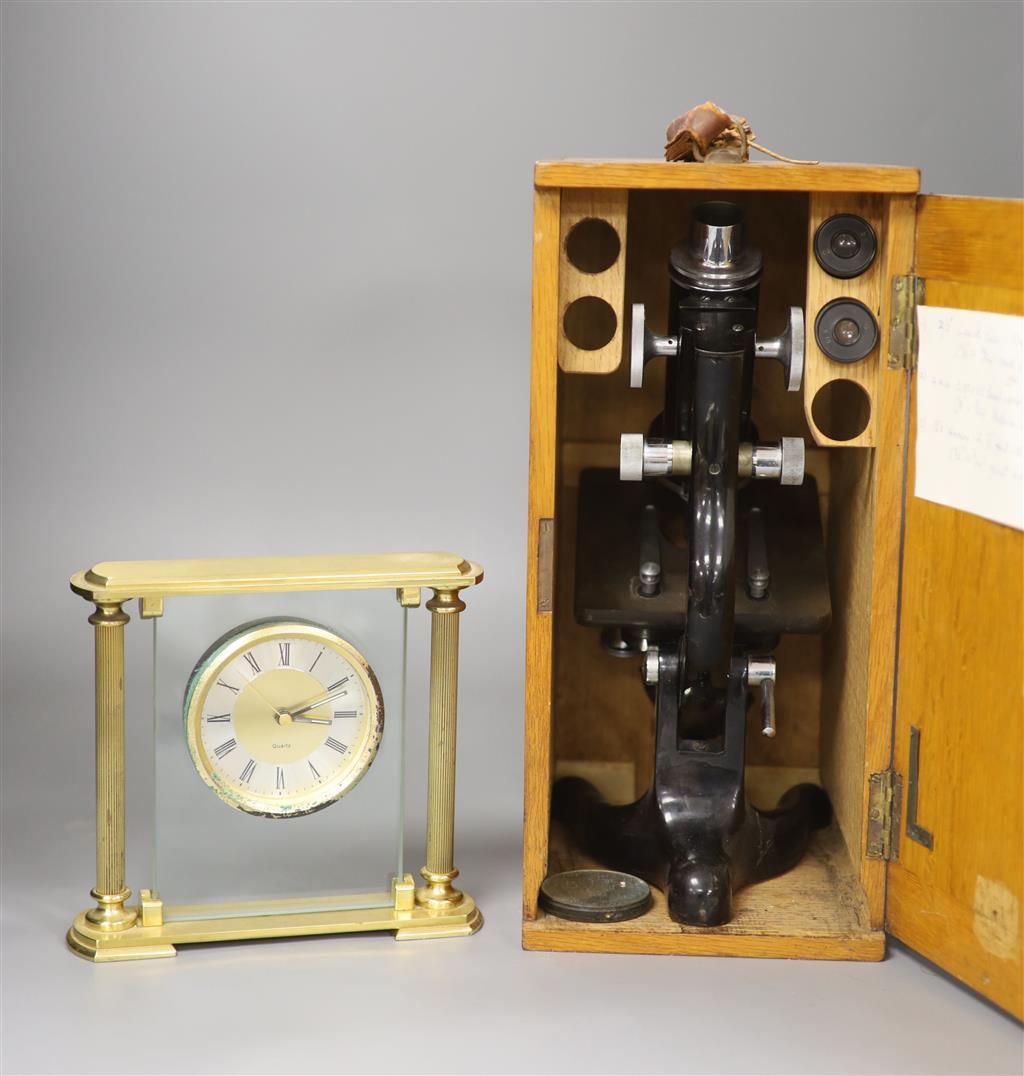 An oak-cased black japanned microscope, case 35cm high, width 16cm, 20cm depth and a brass mantel timepiece